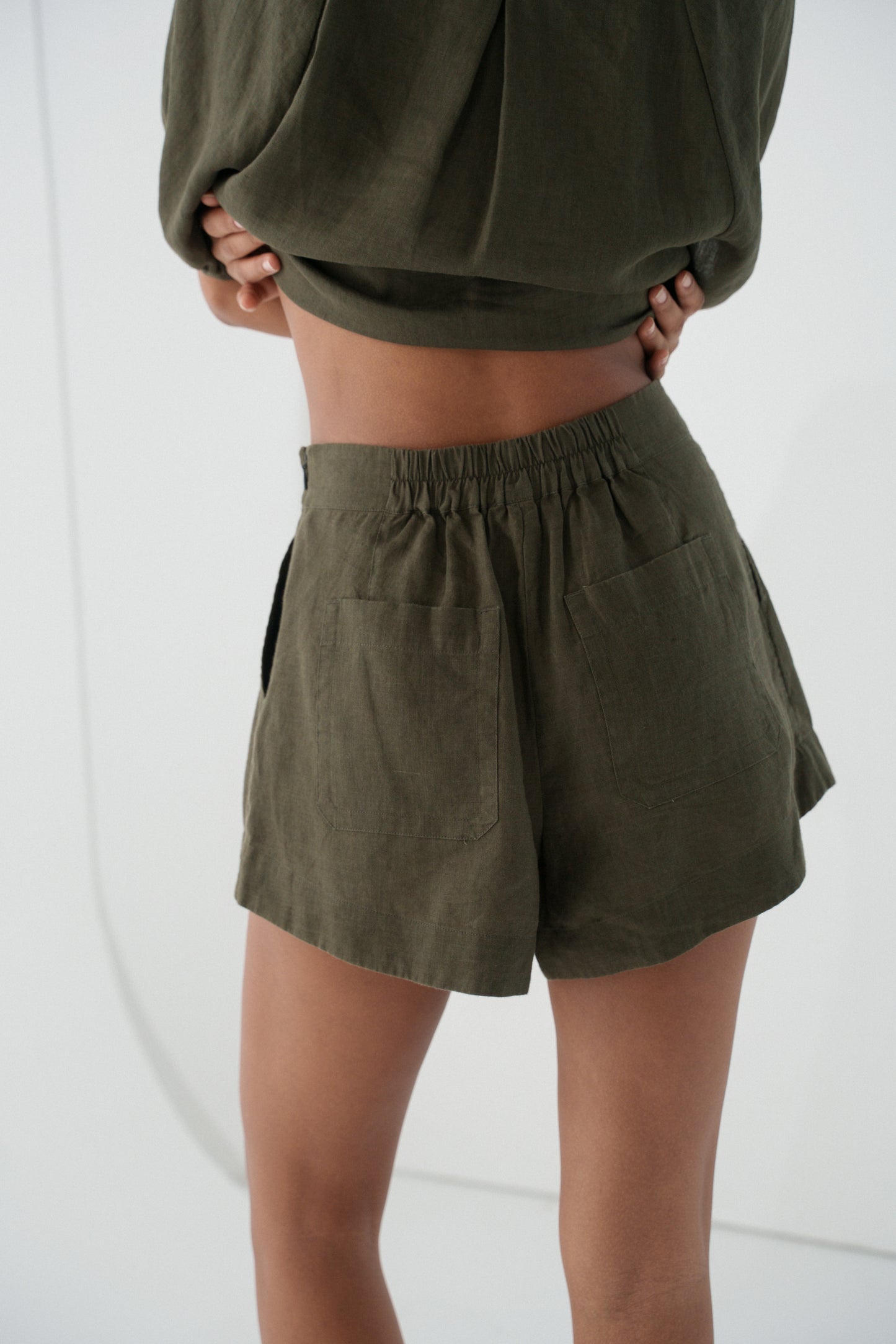 LILLY PILLY Gaia linen shorts in Khaki close up back view