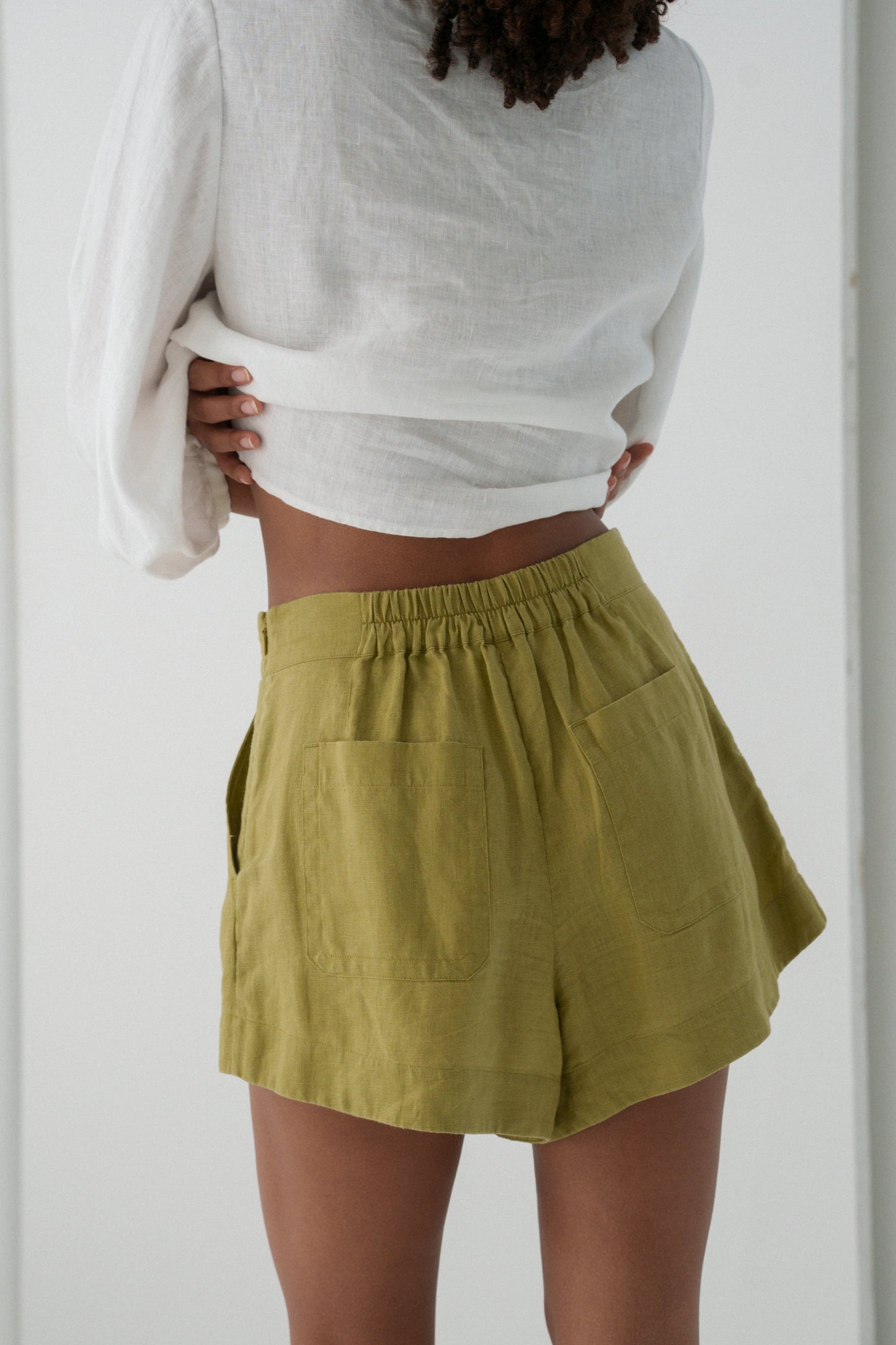 LILLY PILLY Gaia linen shorts in Olive green back close up view