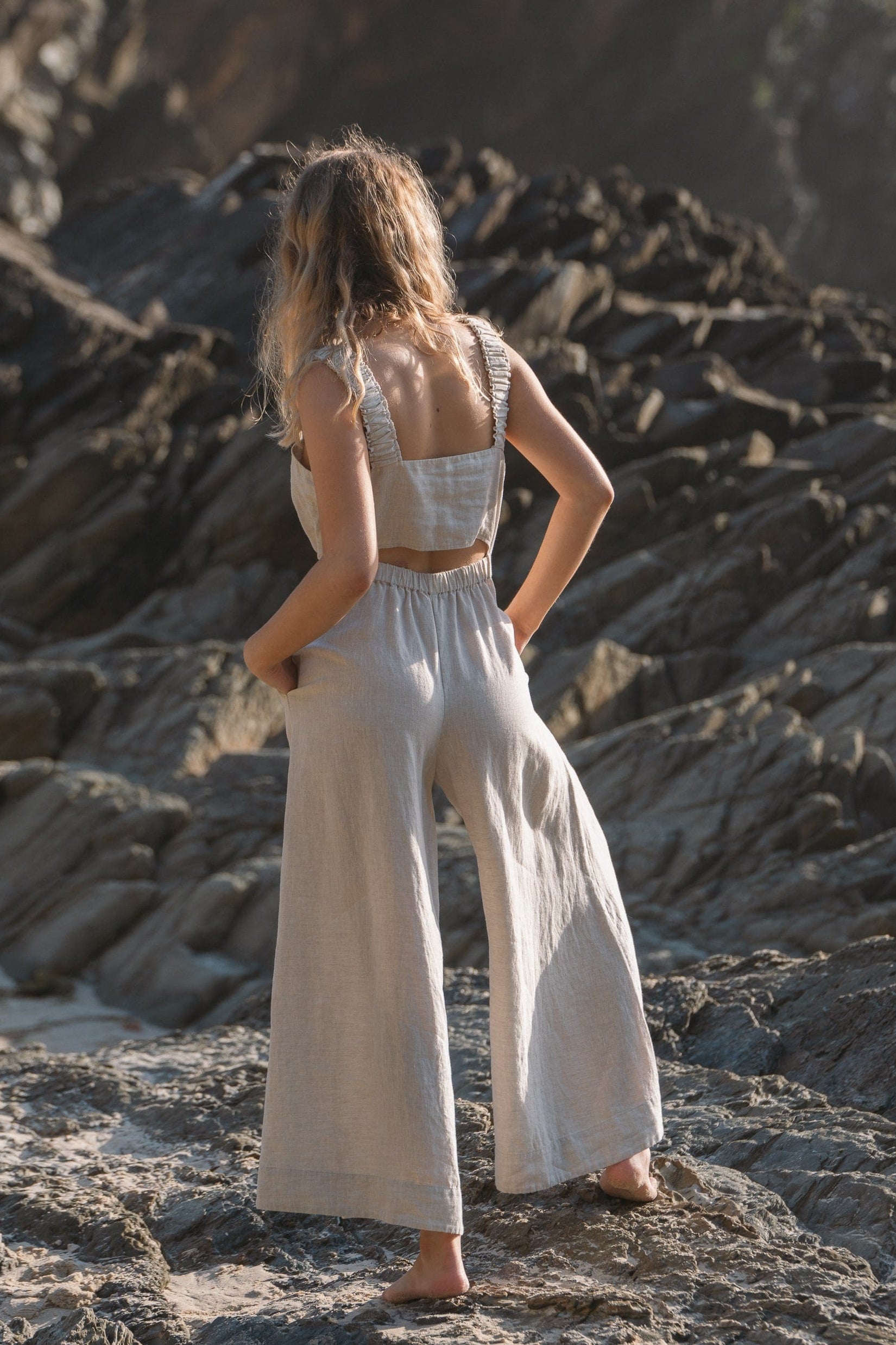Lilly Pilly Collection European linen Keely jumpsuit in Oatmeal back view walking away