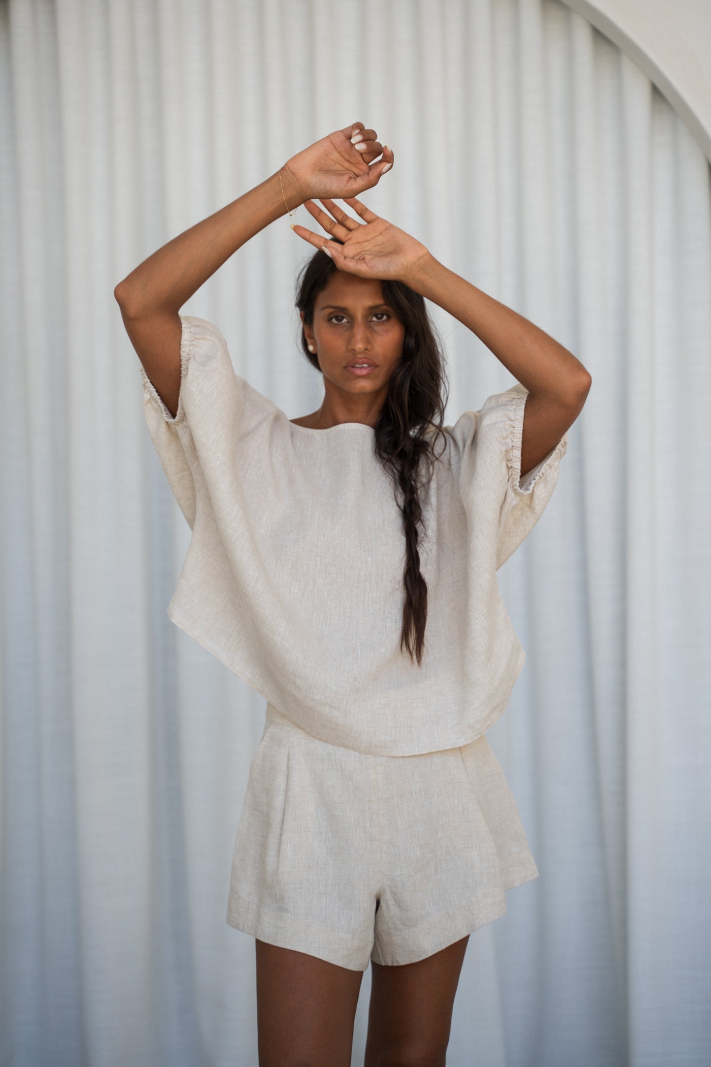 LILLY PILLY Tina linen top in Oatmeal front view with white curtain background