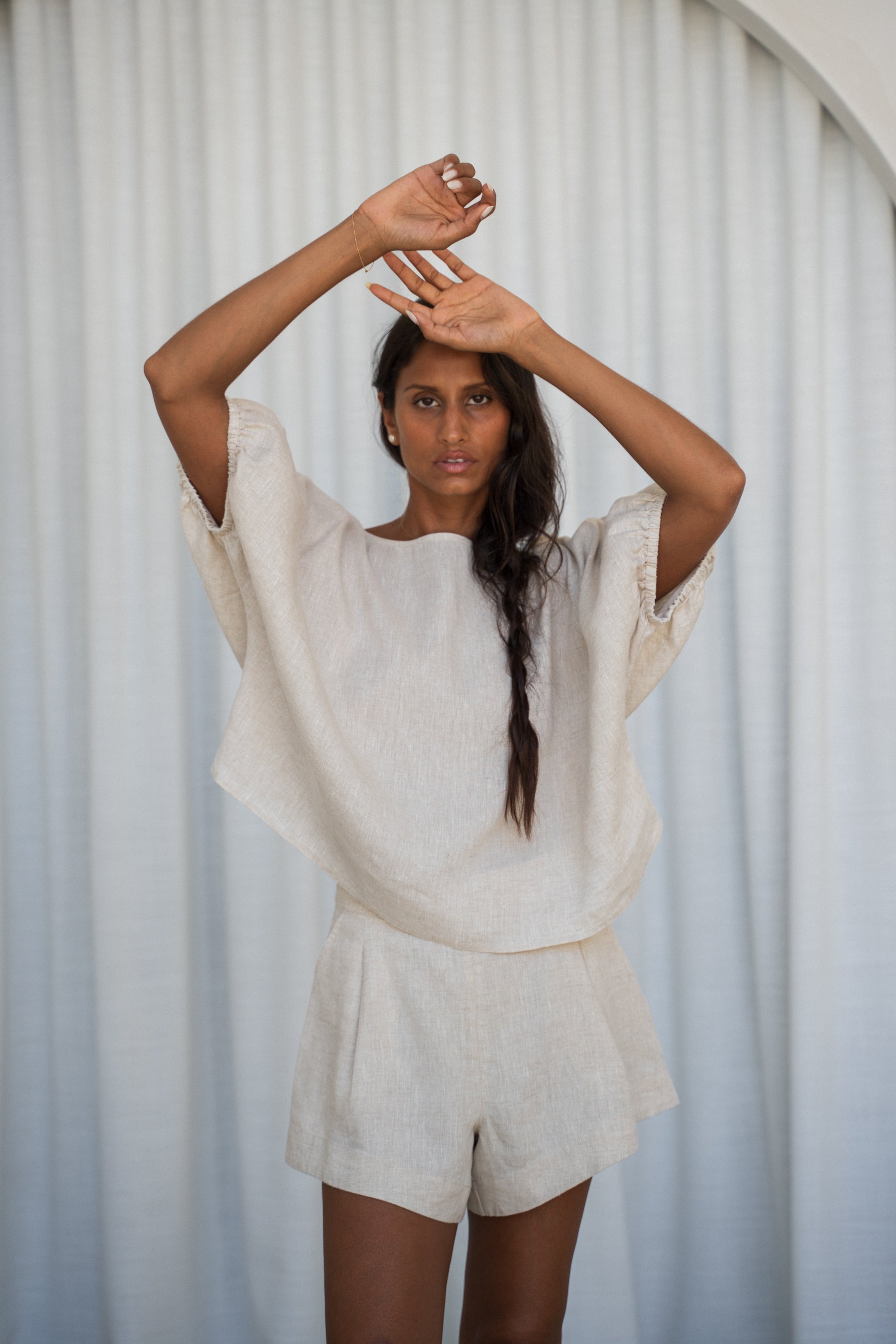 LILLY PILLY Tina linen top in Oatmeal front view with white curtain background