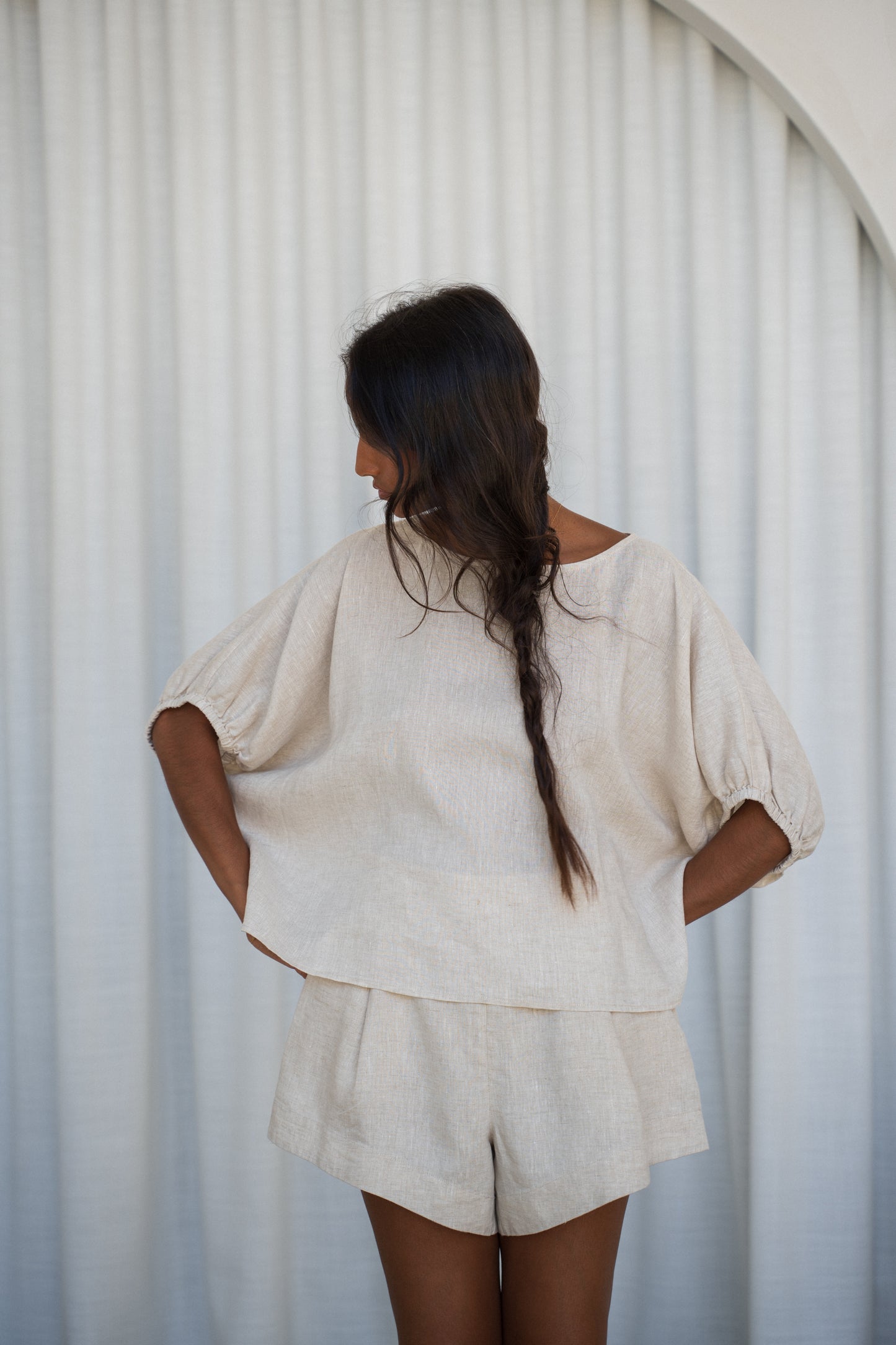 LILLY PILLY Tina linen top in Oatmeal with Gaia shorted showing front view with white curtain background