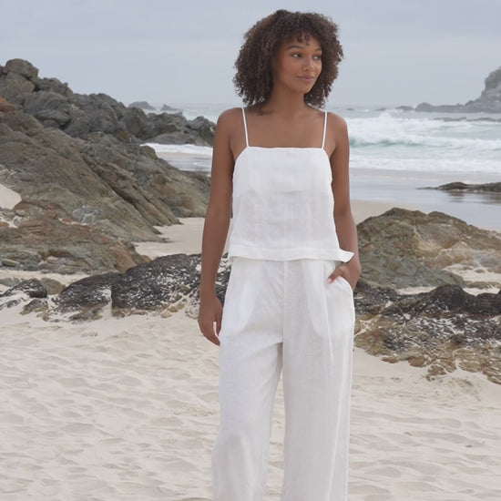 LILLY PILLY Rosa linen top paired with Ivy linen pants in ivory along the beach