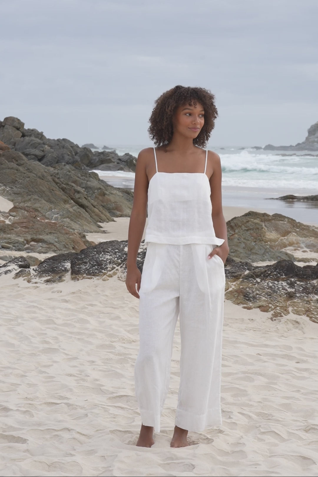 LILLY PILLY Rosa linen top paired with Ivy linen pants in ivory along the beach