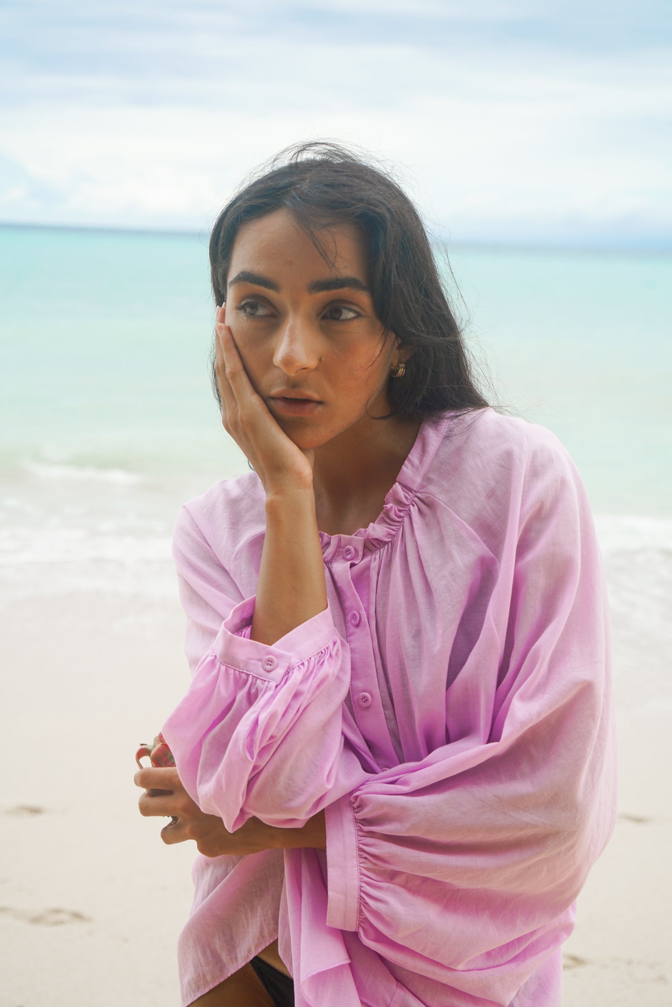 LILLY PILLY woman wearing a orchid Thalia cotton voile shirt  blouse with her arms crossed by the seaside